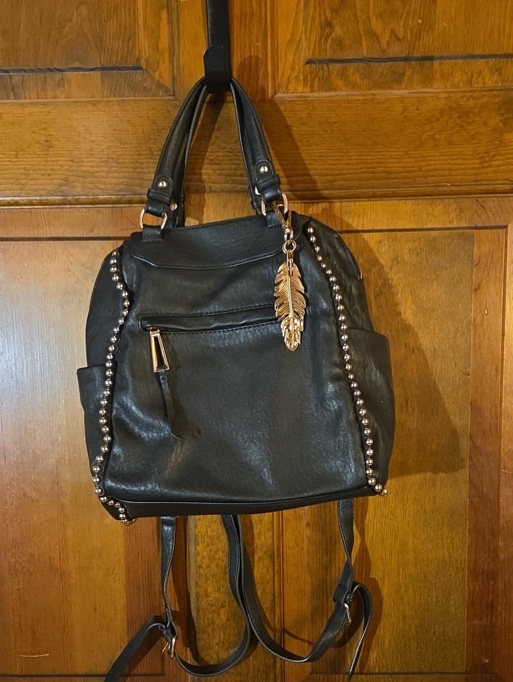 Jessica Simpson Black Studded Backpack with Gold Feather Charm